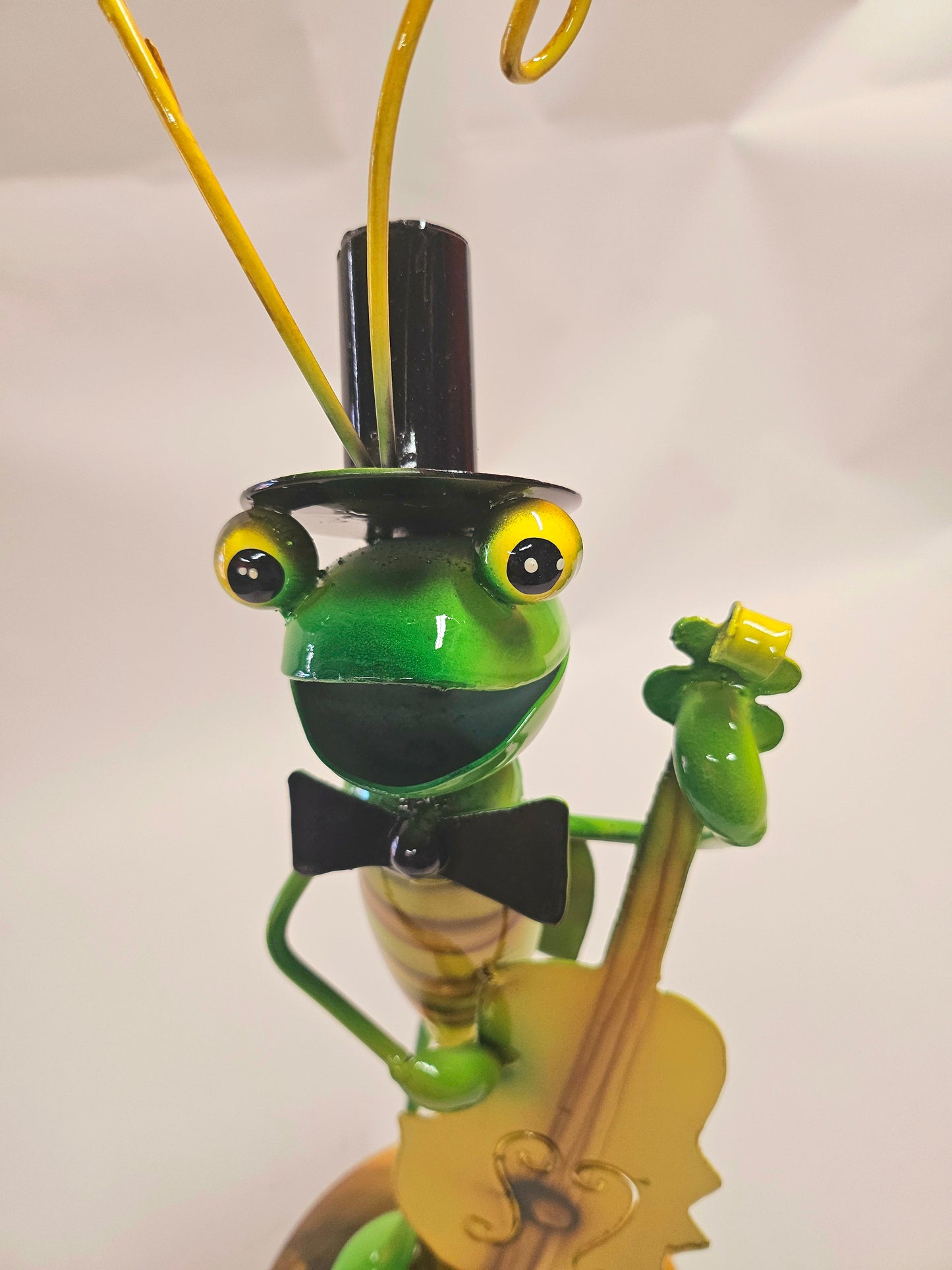 Handcrafted metal musical grasshopper