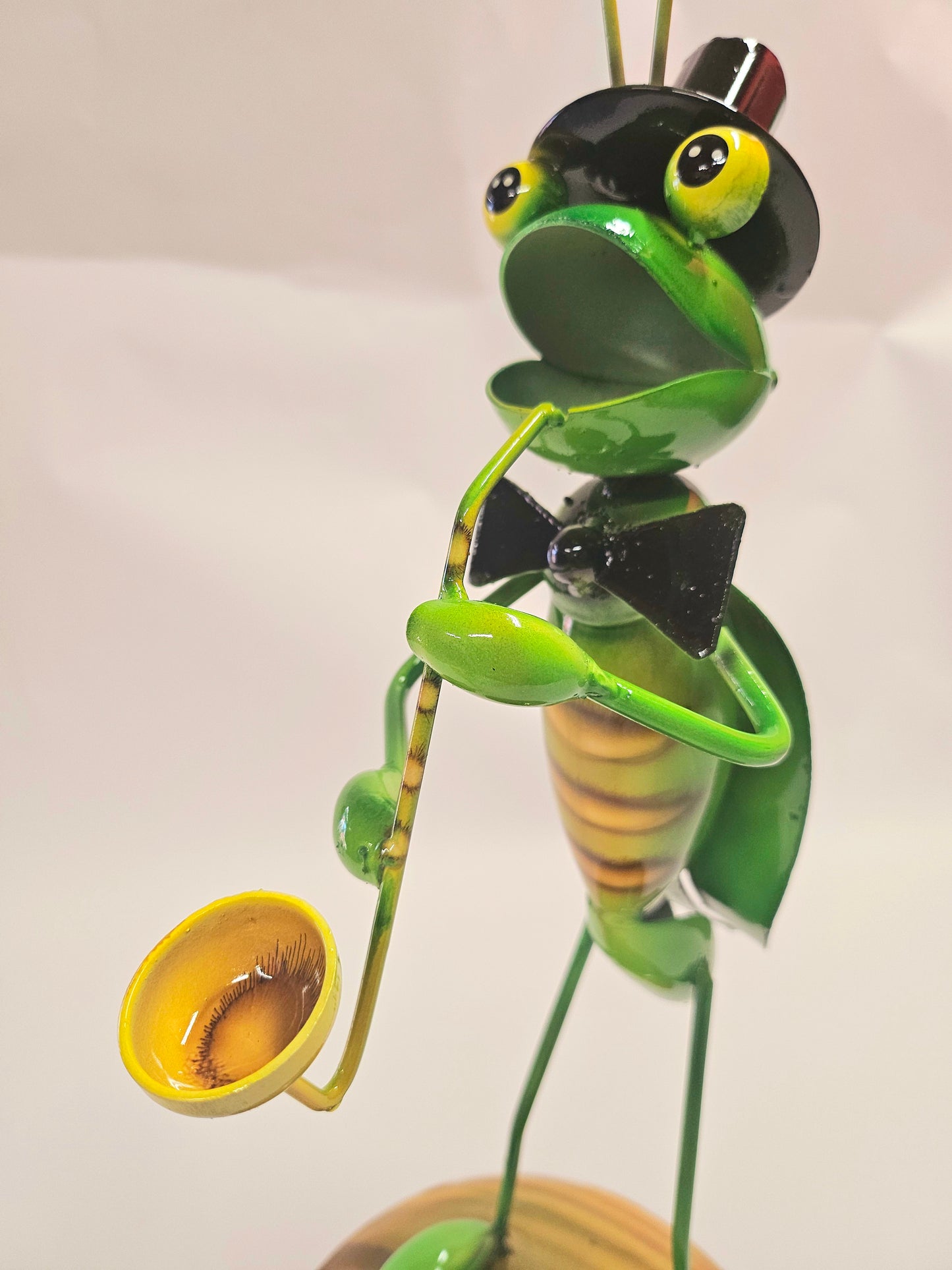 Handcrafted metal musical grasshopper