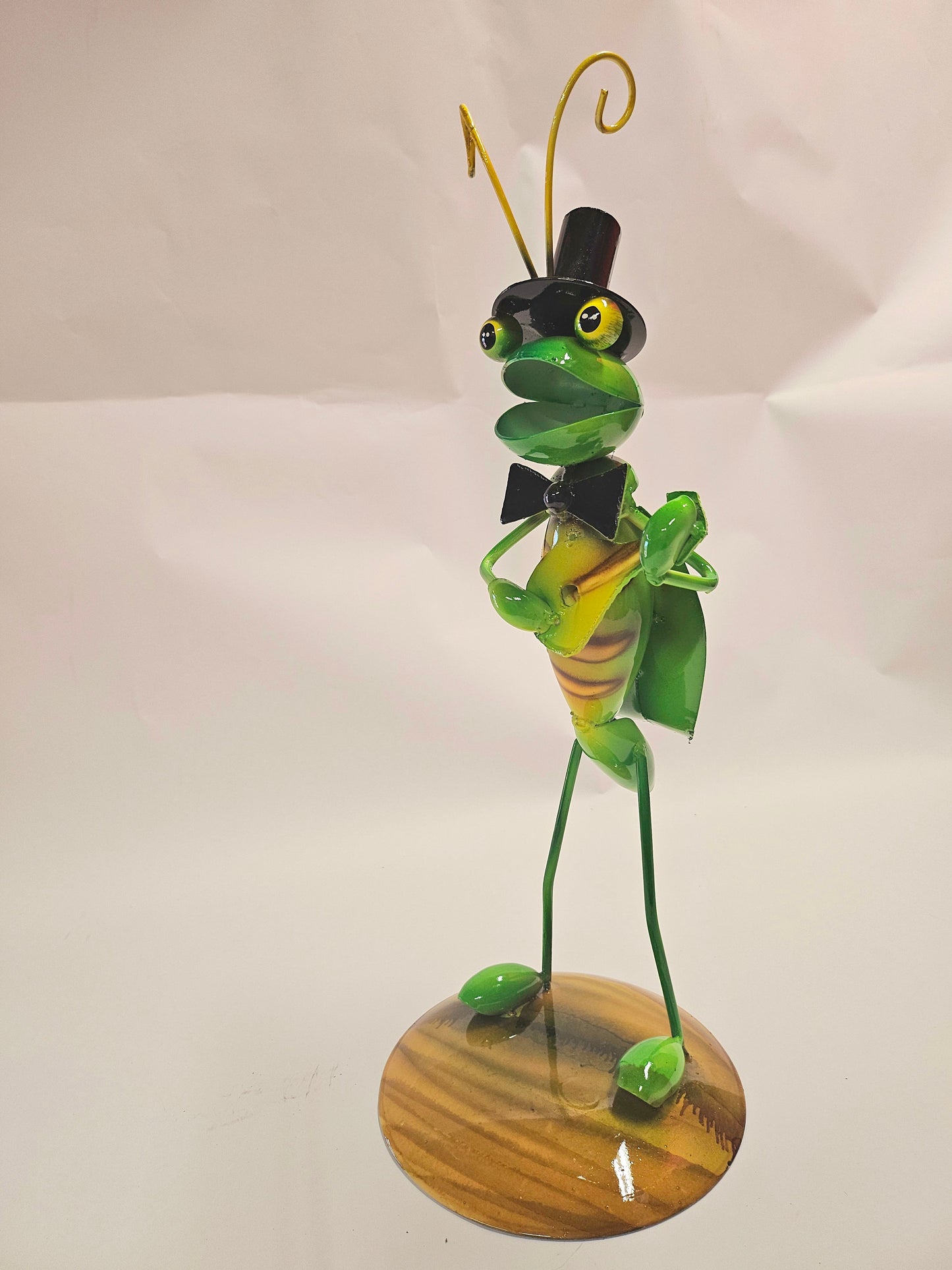 Handcrafted metal musical grasshopper