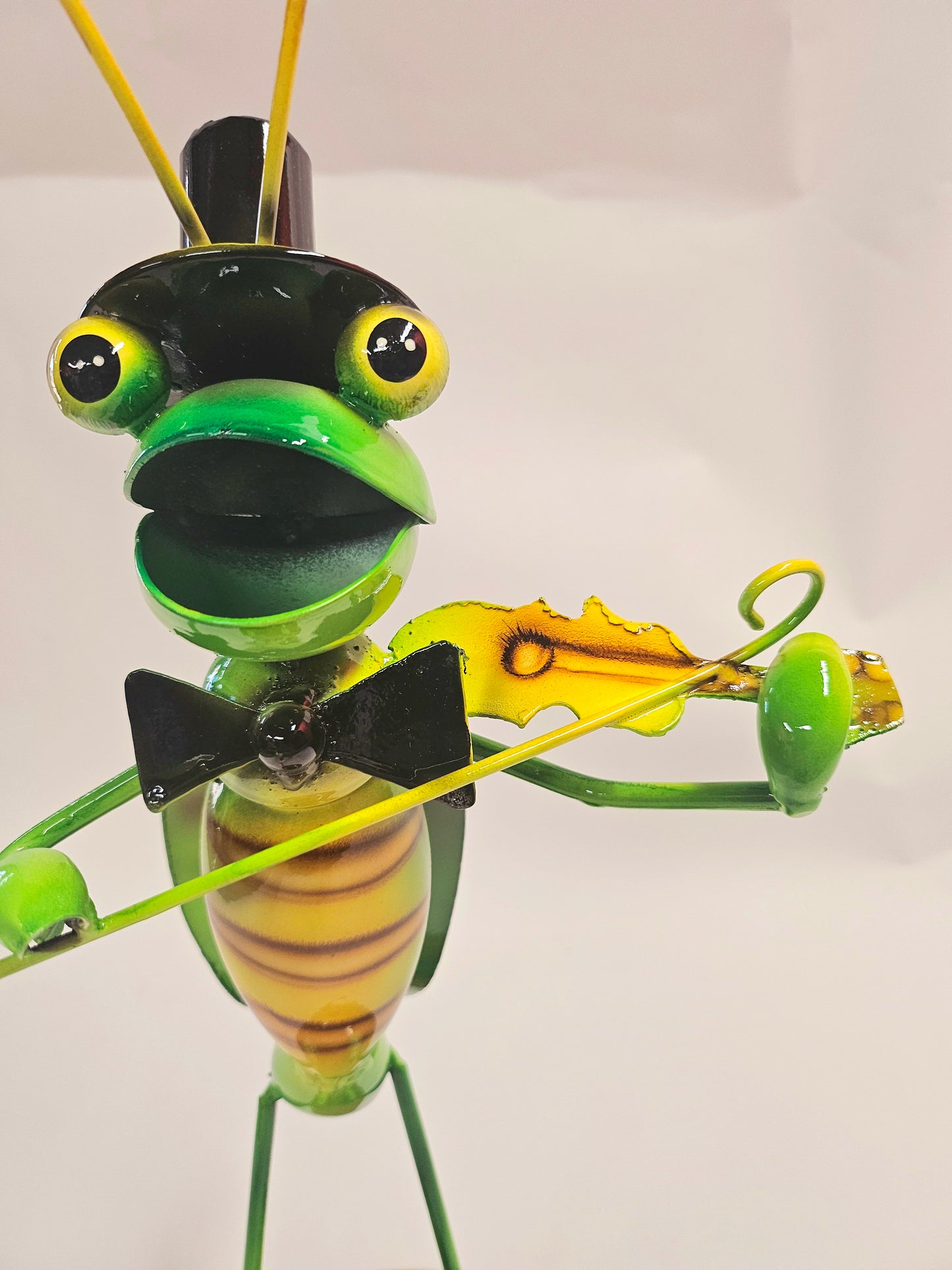 Handcrafted metal musical grasshopper